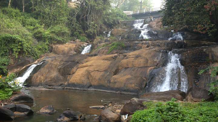 Witness the Beauty of Aruvikuzhy Waterfall