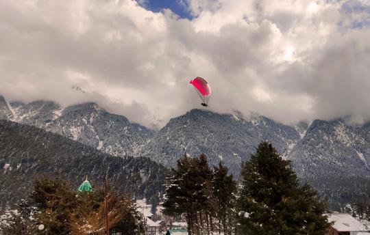 Go for a Paragliding Session (Weather Permitting)